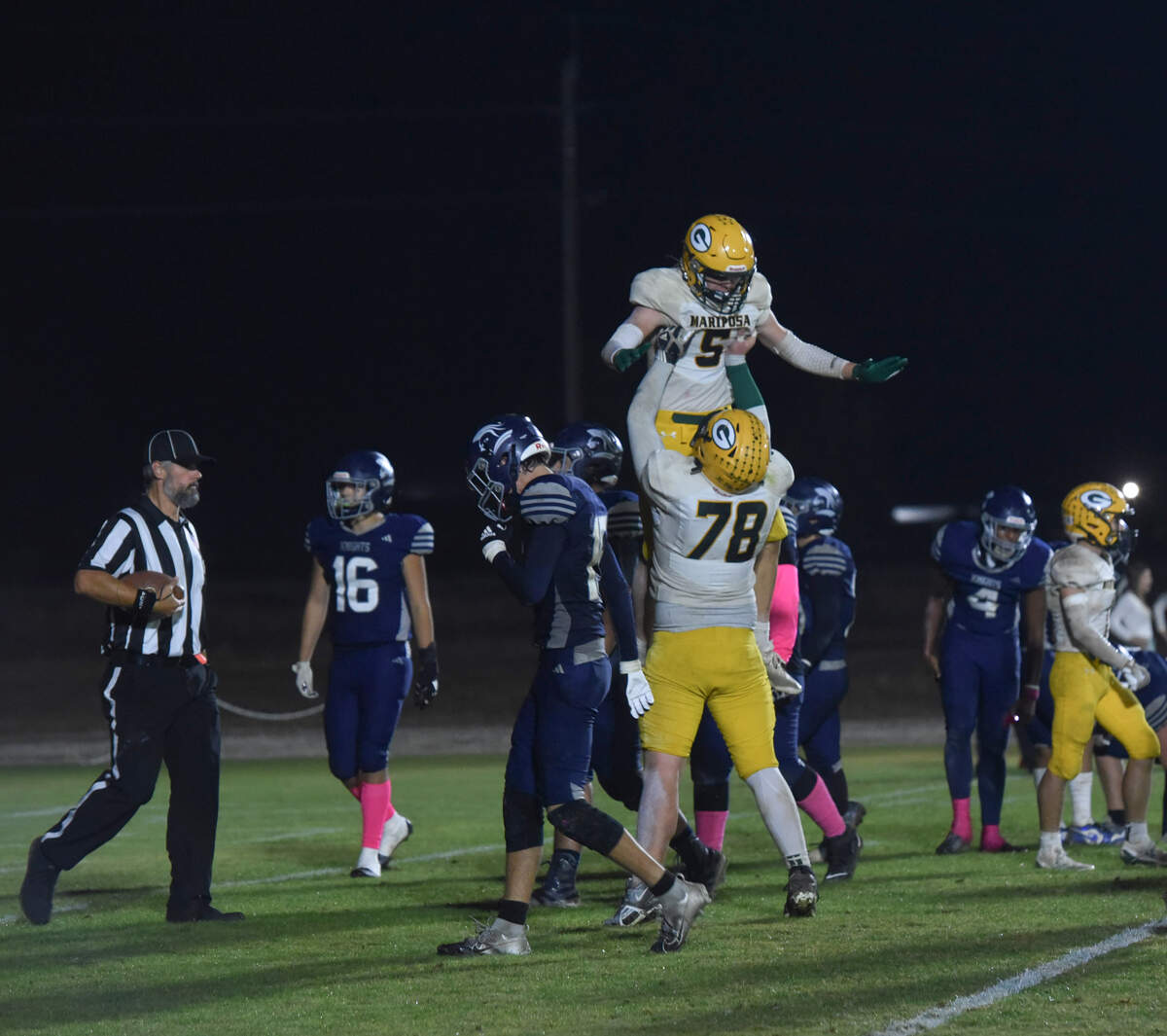 Mariposa County players celebrate after scoring a touchdown during the second half of Friday night’s Southern League game against Stone Ridge Christian in Franklin.