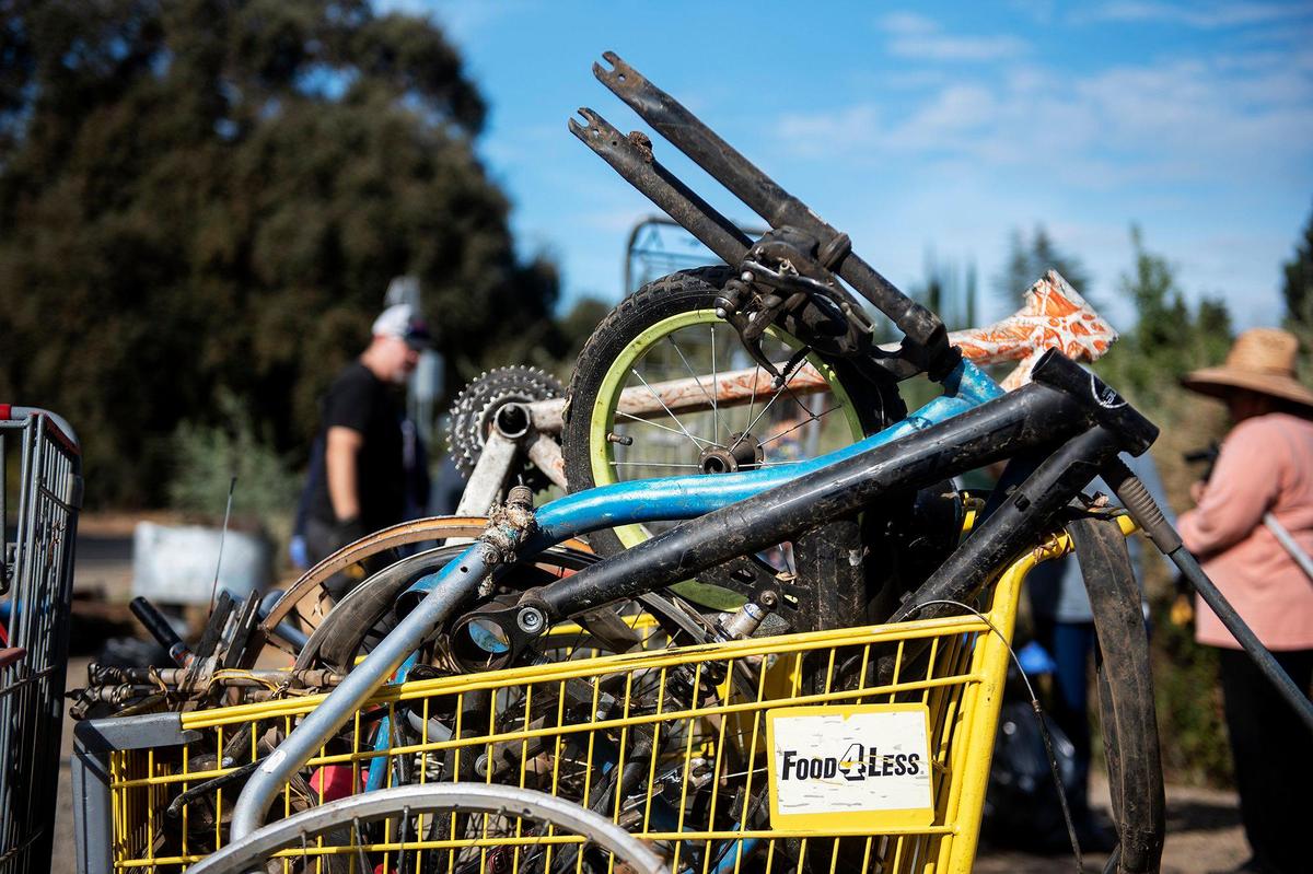 Trash and debris collected from along the banks of Bear Creek near McKee Road during a cleanup event presented by the Merced non-profit Bear Creek Yacht Club in Merced, Calif., on Saturday, Oct. 14, 2023.