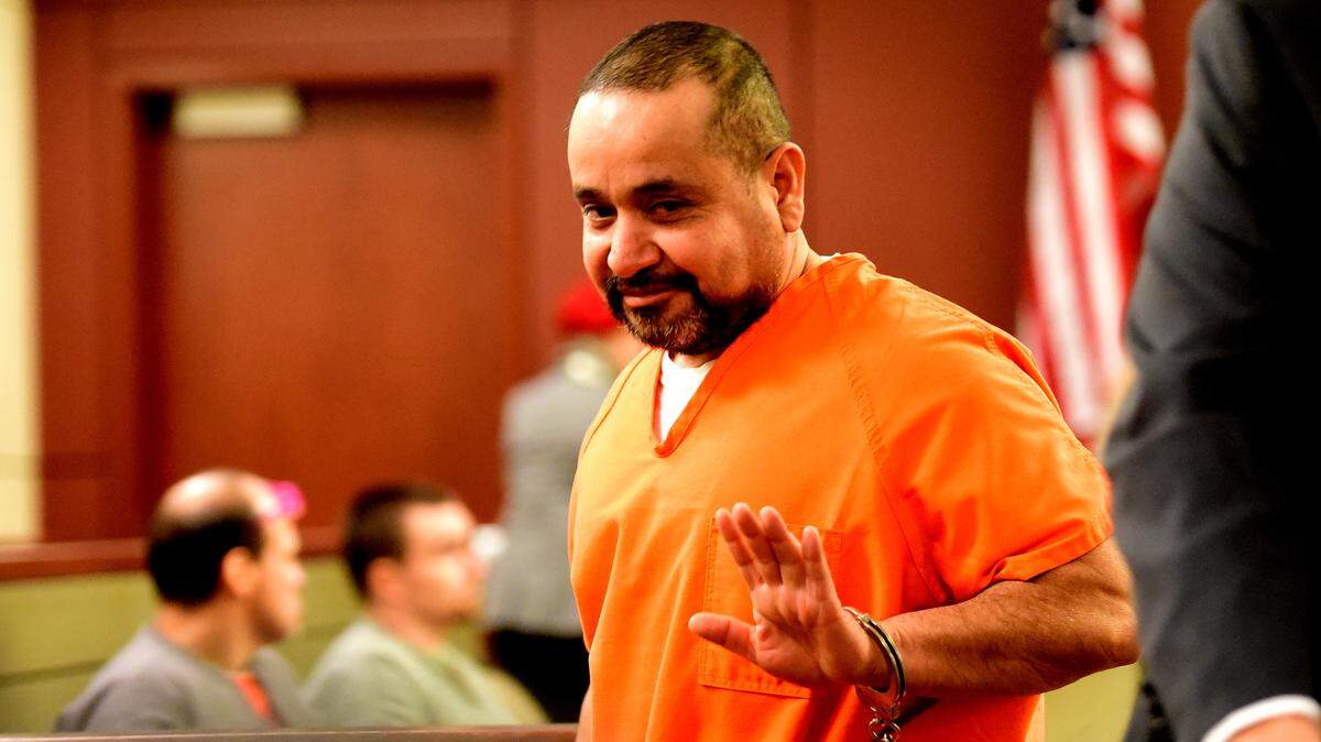 Jesus Ortega, 47, waves at family members in the Merced County Superior Courthouse on Wednesday, Jan. 16, 2019, after pleaded not guilty to stabbing his girlfriend to death in 2010.