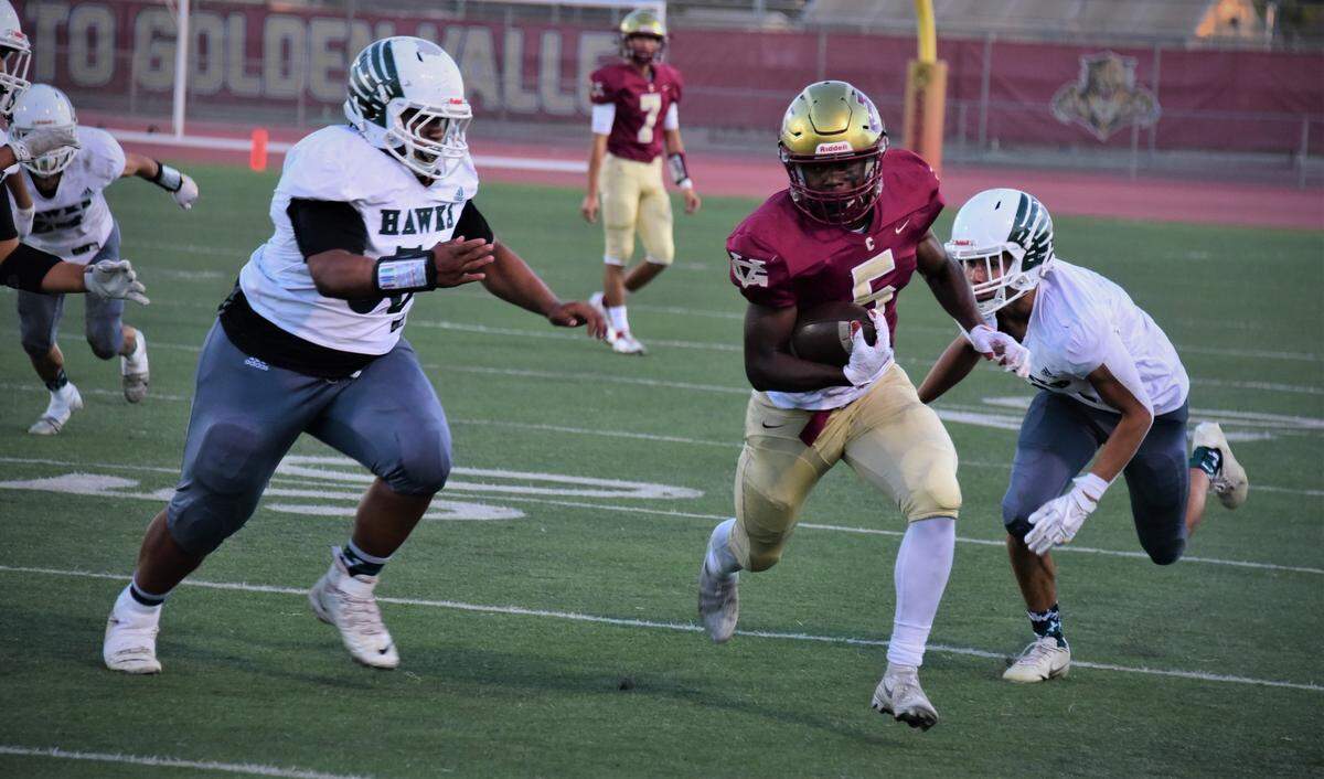 Golden Valley senior running back Jabari Phillips runs the ball during a game against Central Valley on Wednesday, Sept. 29, 2021 at Veterans Stadium in Merced, Calif. . Phillips finished with 298 rushing yards and five touchdowns.