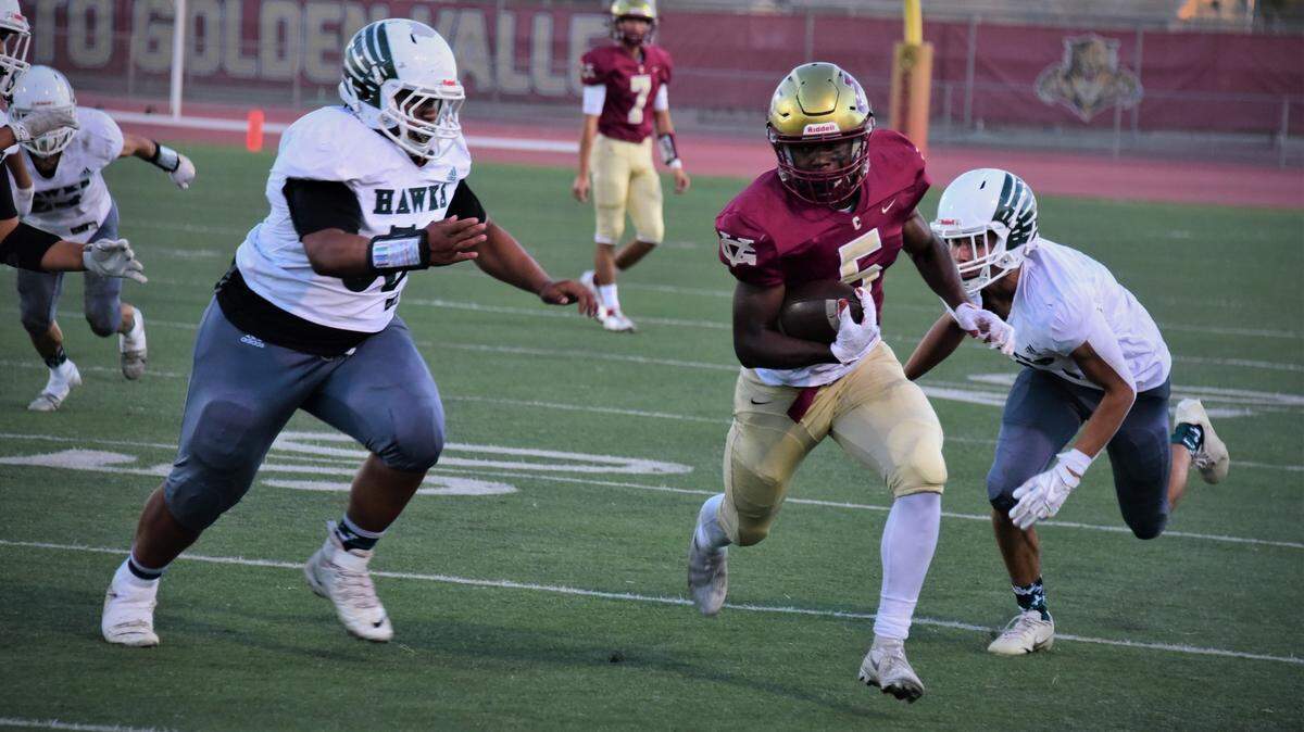 Golden Valley senior running back Jabari Phillips runs the ball during a game against Central Valley on Wednesday, Sept. 29, 2021 at Veterans Stadium in Merced, Calif. . Phillips finished with 298 rushing yards and five touchdowns.