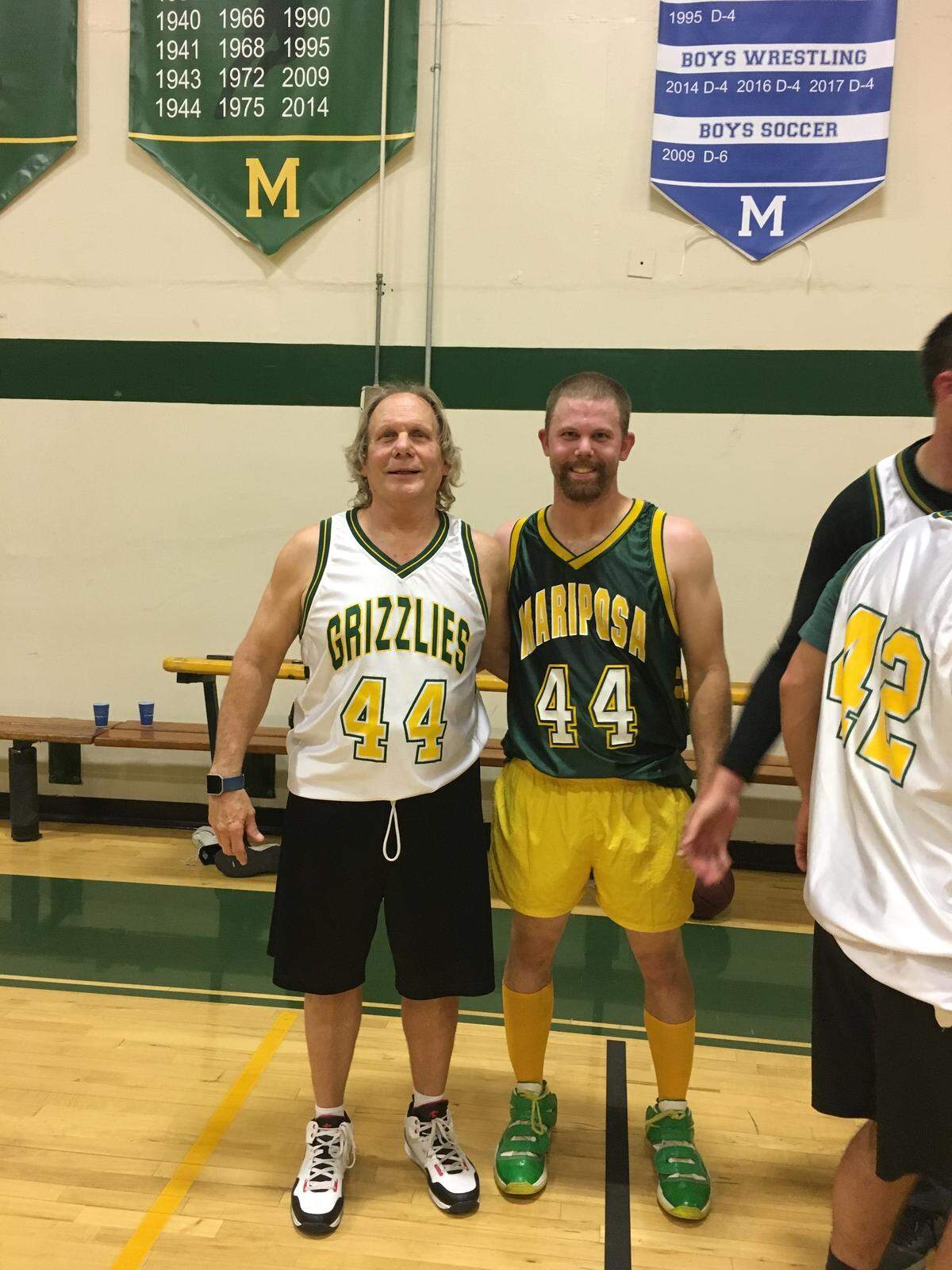 Mariposa girls basketball coach Trace DeSandres (left) poses for a picture with his son Tim during an alumni basketball game in November of 2018 at Mariposa High School.