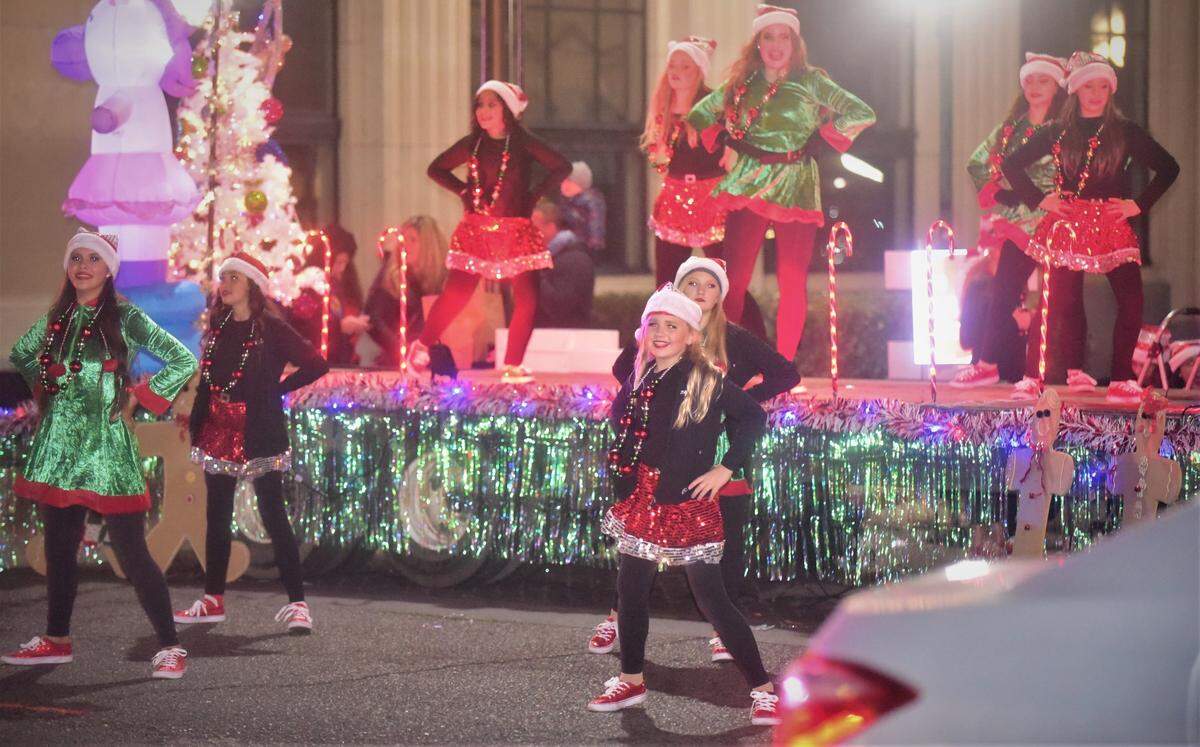 Dancers from Denisa’s School of Dance perform during Merced’s Christmas Tree Lane “reverse parade” on Saturday, Dec. 4, 2021 in Merced, Calif.