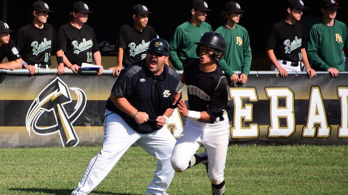 Buhach Colony’s Daniel Casso races home as third base coach Joe Medeiros reacts in the background. The Thunder advanced to the Final Four in the Sac-Joaquin Section Division III playoffs with a 6-2 win over Rio Americano on Friday, May 17, 2019.