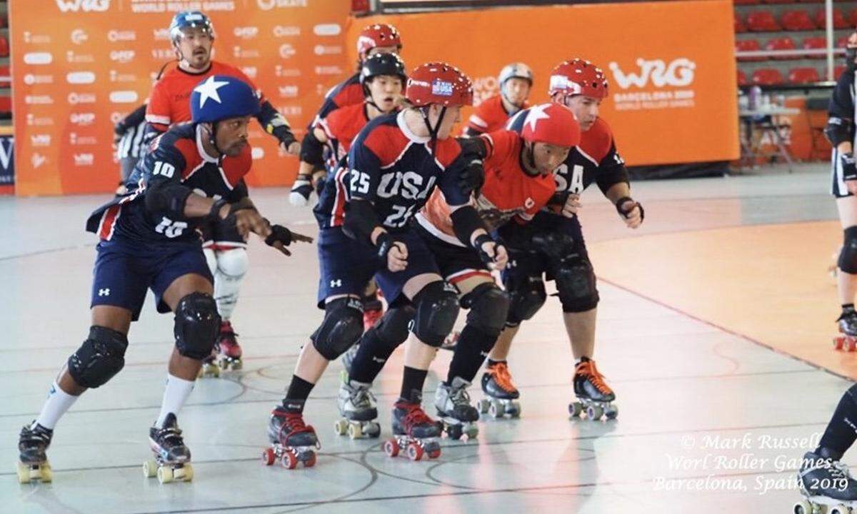 Merced’s Tyler Van Winkle (25) attempts to block an active scorer during the World Roller Games in Barcelona, Spain.
