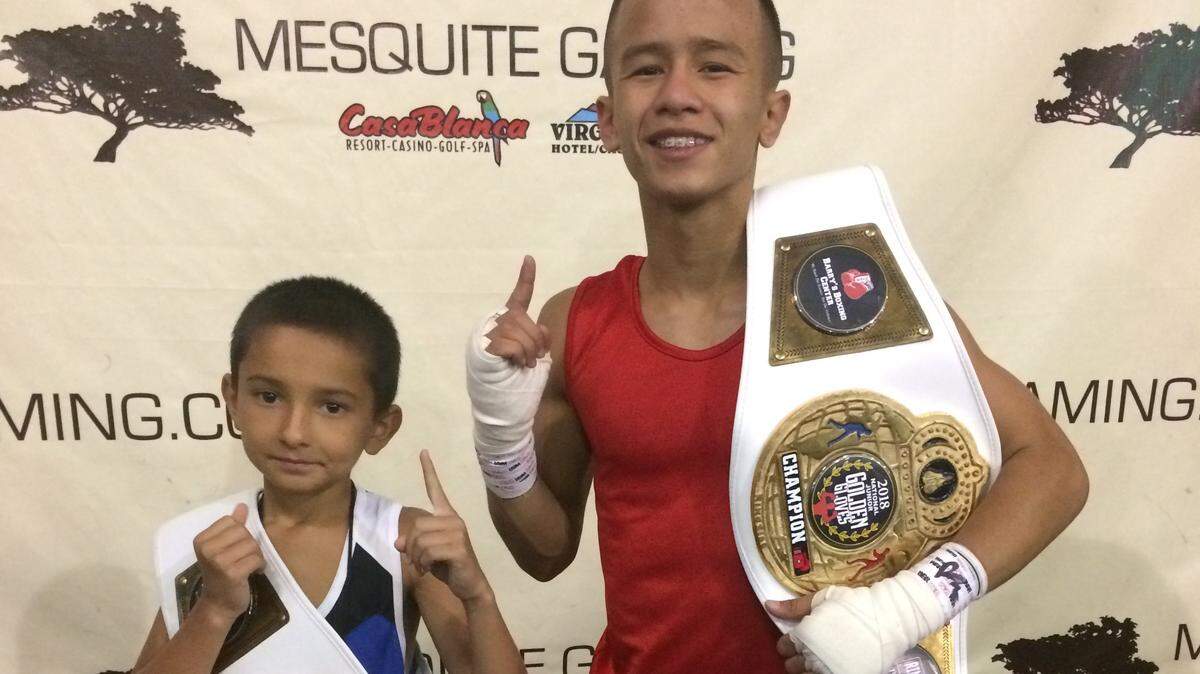 Merced boys Joseph Martinez, 9, left, and 15-year-old Jesus Haro, right, won national championships in their weight and age divisions at the Junior Golden Gloves boxing tournament held in Mesquite, Nev., July 18 to 21, 2018.