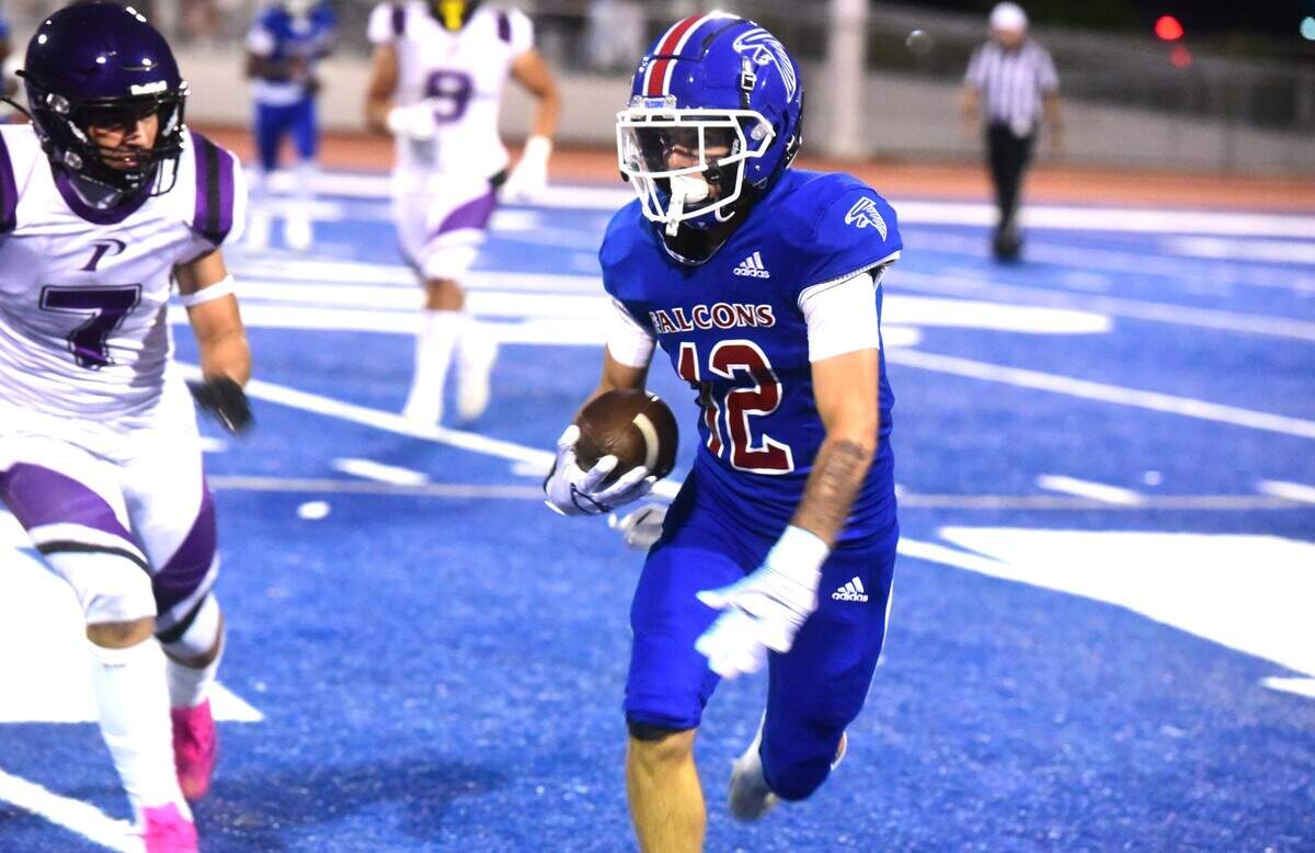 Atwater High receiver Landon Perez (12) makes a catch and run during a game against Pacheco on Friday, Aug. 23, 2024 at Dave Honey Stadium in Atwater, Calif.