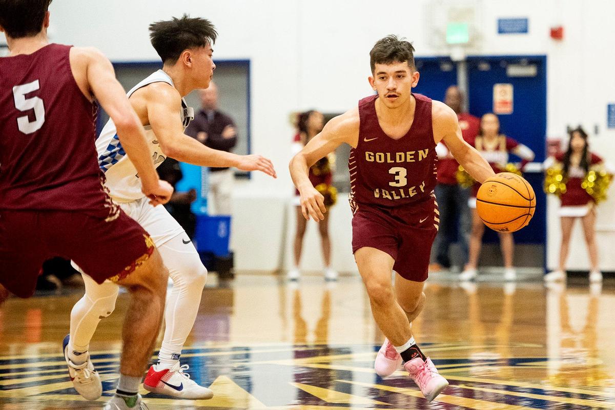 Golden Valley senior Ricardo Perez (3) dribbles past a defender during a game against Atwater at Atwater High School in Atwater, Calif., on Monday, Jan. 29, 2024.