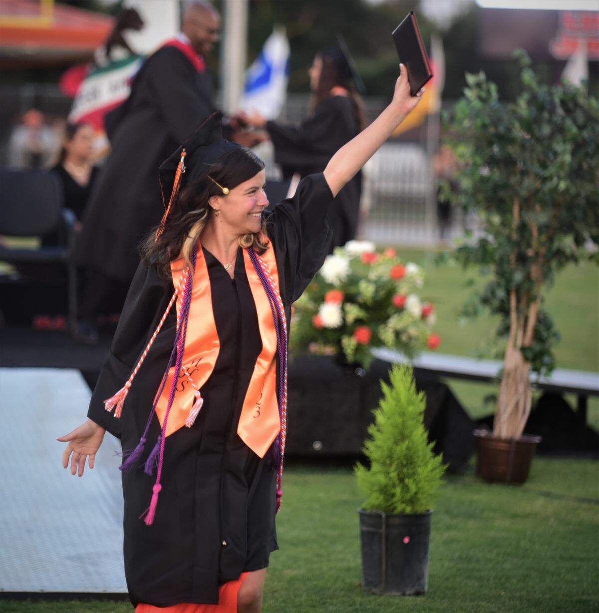 Merced High School graduate Leah Charriez reacts after receiving her diploma during the school’s graduation ceremony on Thursday, June 1, 2023.