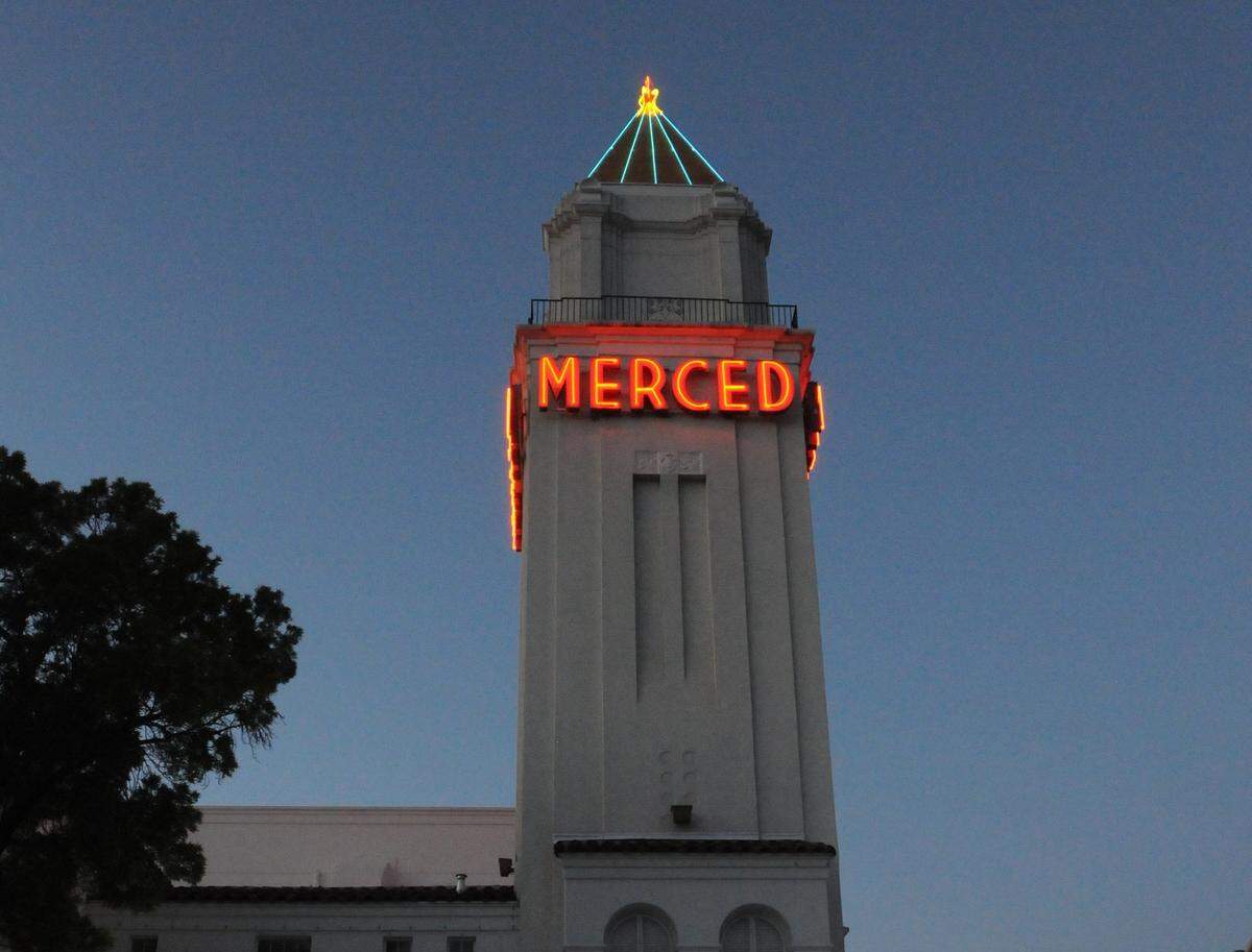 CHRISTOPHER WINTERFELDT/cwinterfeldt@mercedsunstar.comThe Merced Theatre Tower is lit up on a cool and clear evening during the spring time Art Hop on Saturday (4-20-13) in downtown Merced.
