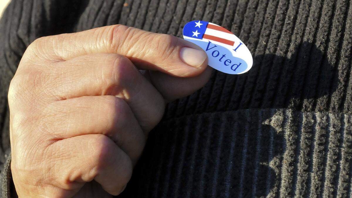 SUN-STAR PHOTO BY LISA JAMES
American Legion Cmdr. and Vietnam veteran Carlos Ramirez shows off his I Voted sticker outside of the American Legion Hall on Main Street in Merced on election day, November 2, 2010.
Voters and pollworkers reported a strong turnout throughout the day.
November 2, 2010


