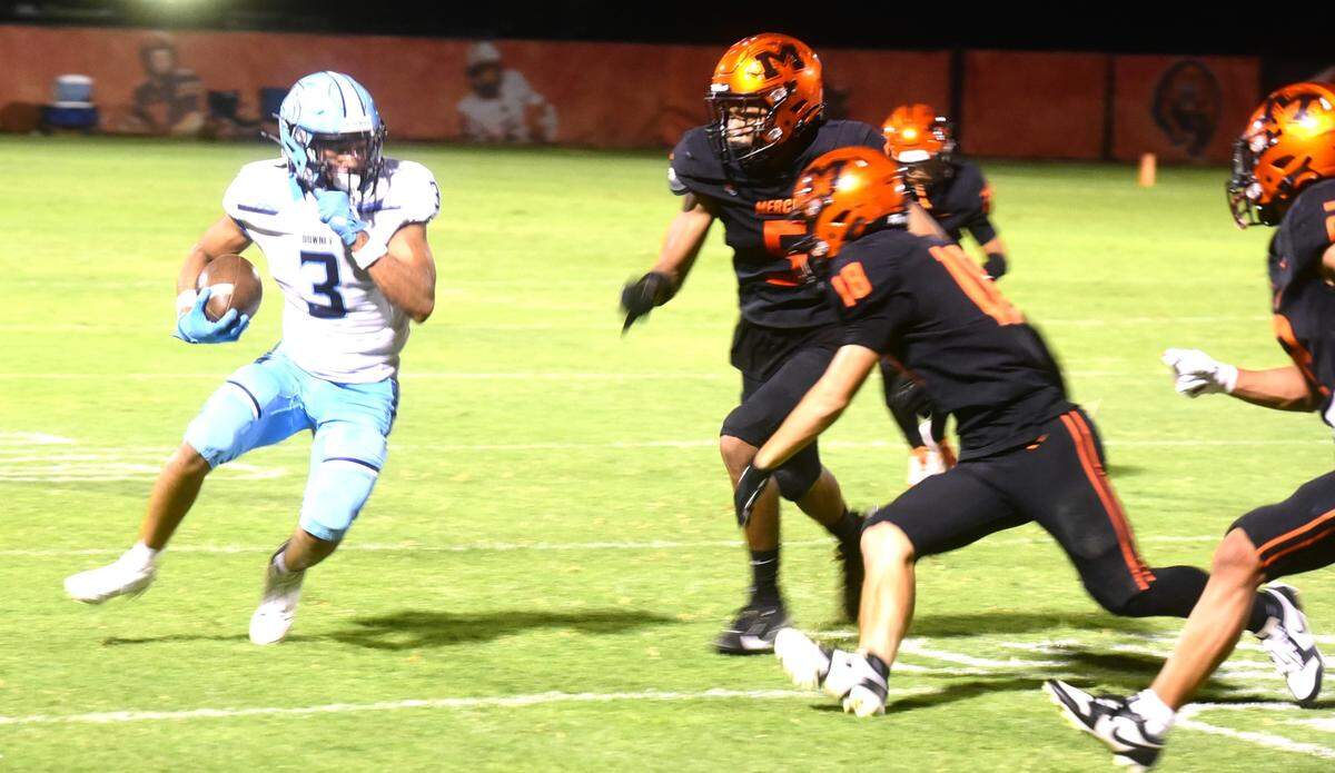 Downey High junior receiver RayMelo Thurman (3) runs after catching a pass during a game against Merced on Friday, Sept. 6, 2024.