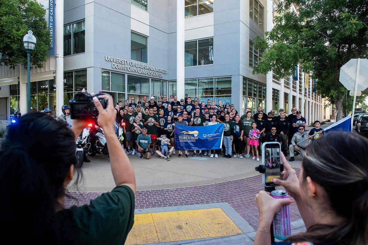 Participants gather for photos following the annual Law Enforcement Torch Run for Special Olympics Northern California in Merced, Calif., on Wednesday, June 25, 2025.
