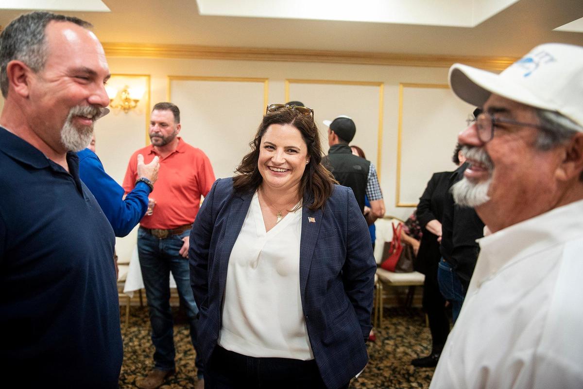 Nicole Silveira, center, a Merced County prosecuting attorney and Merced County District Attorney candidate speaks with guests during her campaign party at the Branding Iron restaurant in Merced, Calif., on Tuesday, June 7, 2022.