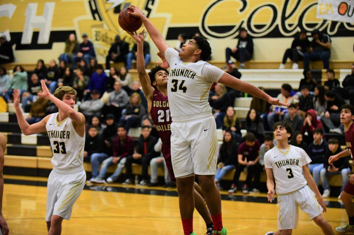 Buhach Colony senior Gerald Braxton blocks the shot of Golden Valley’s Avery Townsel during a game on Friday, Jan. 17, 2020 at Buhach Colony High School.