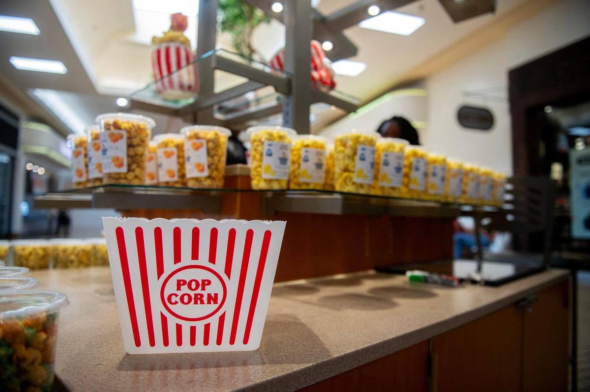 Various flavors of popcorn for sale during the grand opening of Dom’s Bomb Gourmet Popcorn inside the Marketplace at Merced in Merced, Calif., on Thursday, May 1, 2025. The kiosk offers unique gourmet popcorn flavors created by Merced resident Dominique Pruitt.