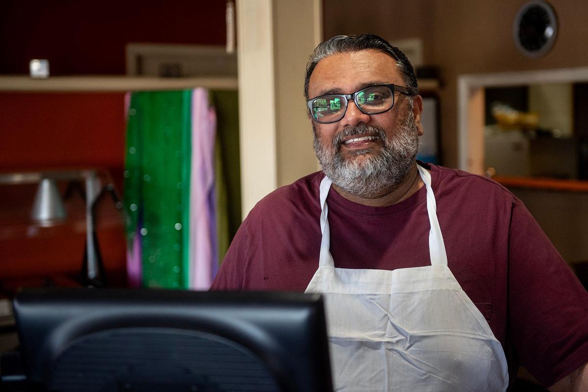 Tate of Little India owner Parm Samra stands behind the register while speaking about his restaurant located at 1052 W. Main Street in Merced, Calif., on Thursday, April 3, 2025. Samra said he was informed that the building has changed ownership and his lease has been terminated. The restaurant will close on April 11.