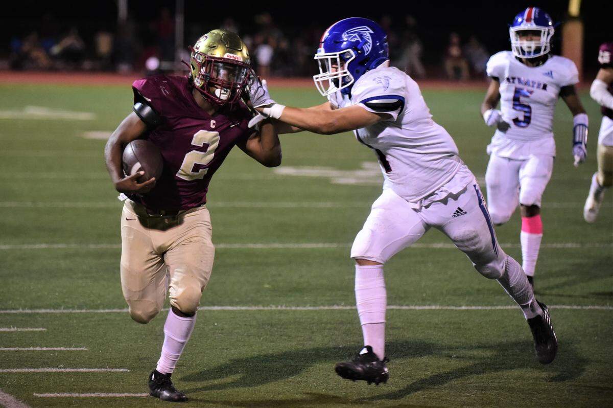 Golden Valley High School senior running back Jahkylle Smith (2) runs the ball during a game against Atwater on Friday, Oct. 7, 2022.