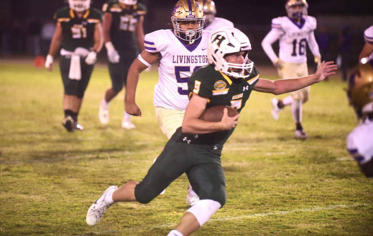 Hilmar High School junior Caden Bailey runs the ball against Livingston on Friday, Sept. 29, 2023.