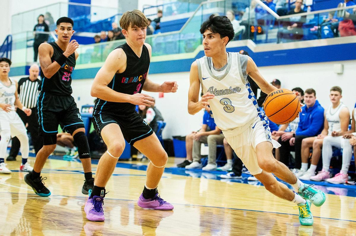 Atwater senior Nicholas Trejo (3) drives the basket during a game against El Capitanat Atwater High School in Atwater, Calif., on Wednesday, Jan 17, 2024.