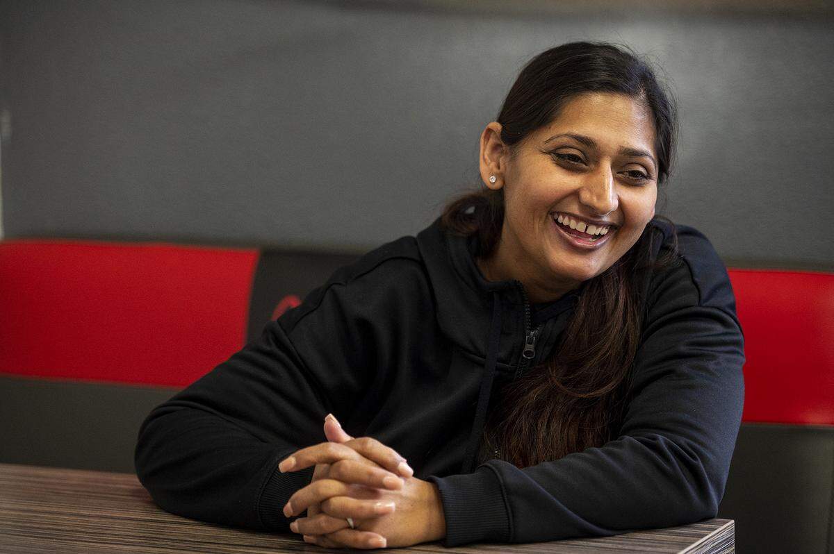 Inderjit Kaur, 32, laughs while speaking about the restaurant Masala Express which she co-owns with her husband Mandip Singh, 32, located at 560 W. Olive Avenue in Merced, Calif., on Thursday, Jan. 5, 2023.