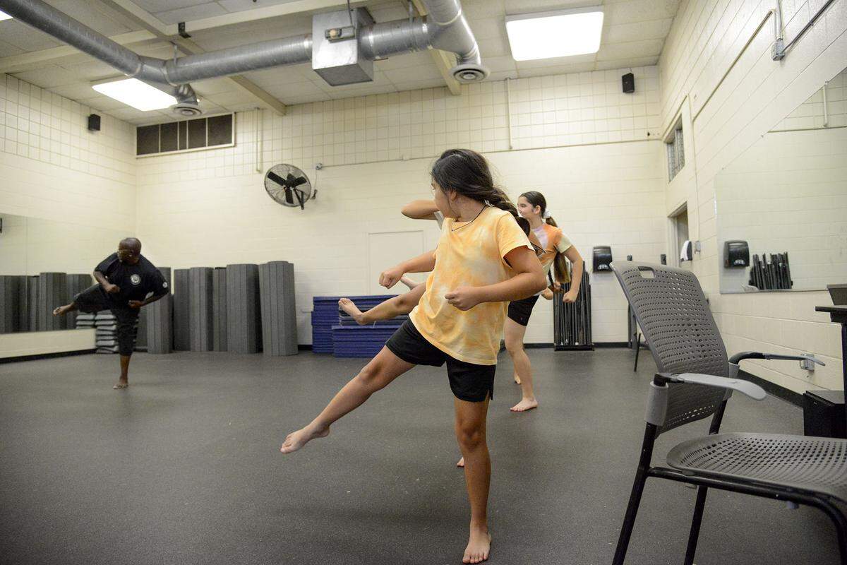 Students of the Merced College for Kids self-defense class learn moves on Monday June 24, 2024.