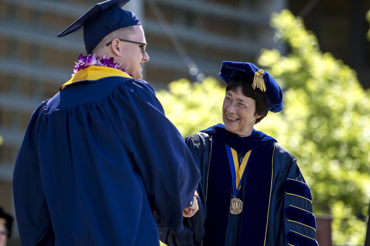 Chancellor Dorothy Leland, right, shakes hands with graduates during the University of California, Merced School of Social Sciences, Humanities and Arts spring commencement in the Carol Tomlinson-Keasey Quad on the UC Merced campus in Merced, Calif., on Saturday, May 12, 2018.