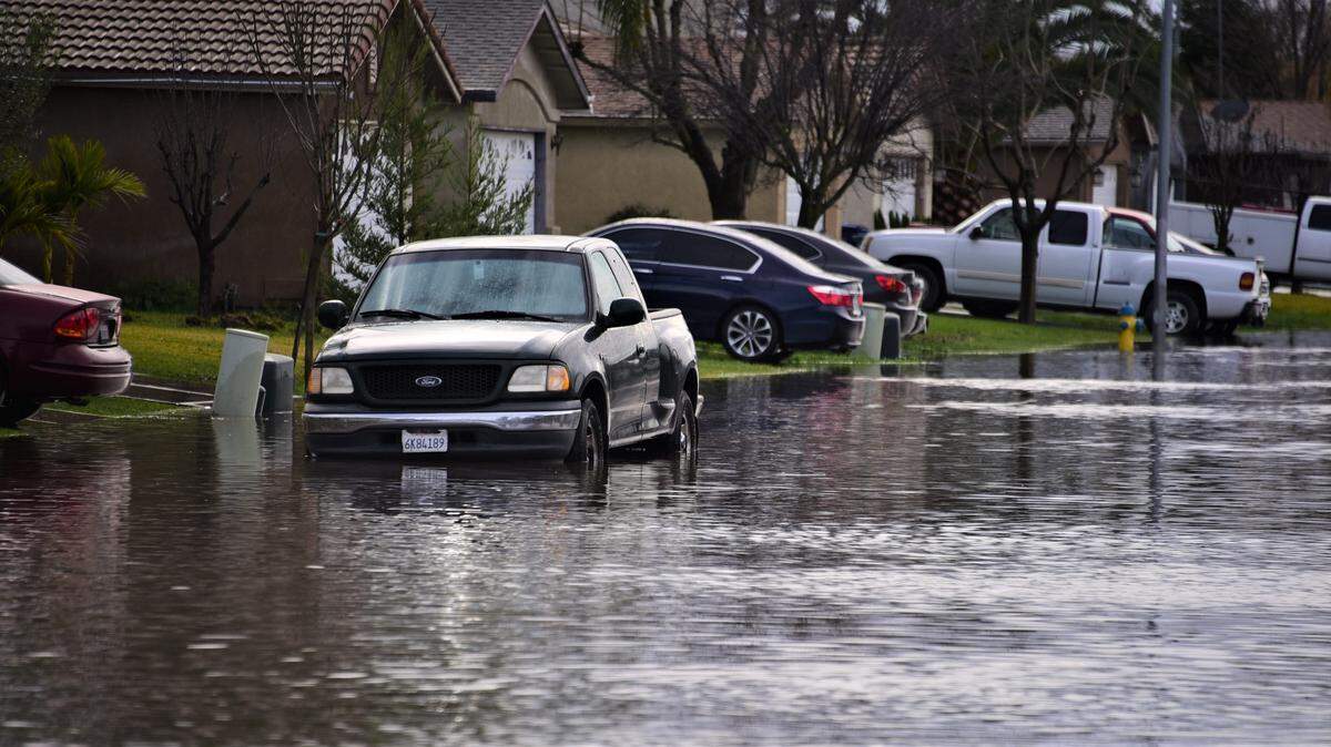 Bodega Avenue is one of the many flooded streets in Planada, Calif. on Tuesday, Jan. 10, 2023.