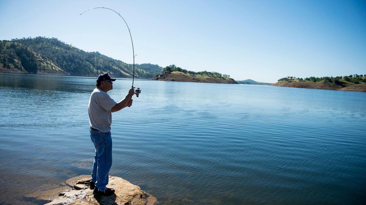 Lester Yamaguchi, 68, of Atwater, casts his line into Lake McClure in 2017.
