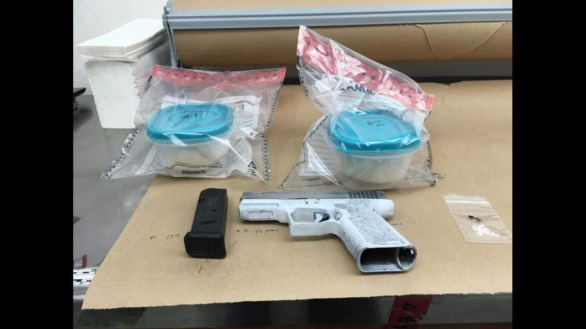 Officers located a concealed handgun in a vehicle and about a pound of suspected methamphetamine while searching the vehicle during a traffic stop in Los Banos, police say.