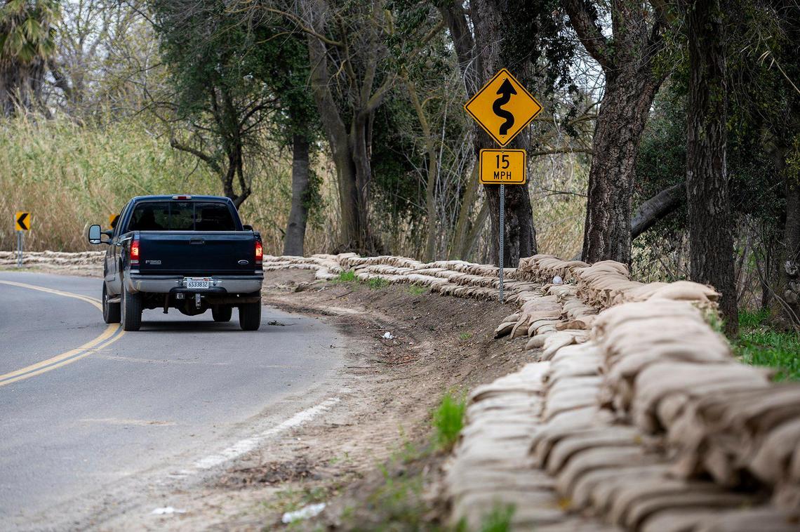 Sandbags line West North Bear Creek drive in Merced, Calif., on Thursday, March 9, 2023.