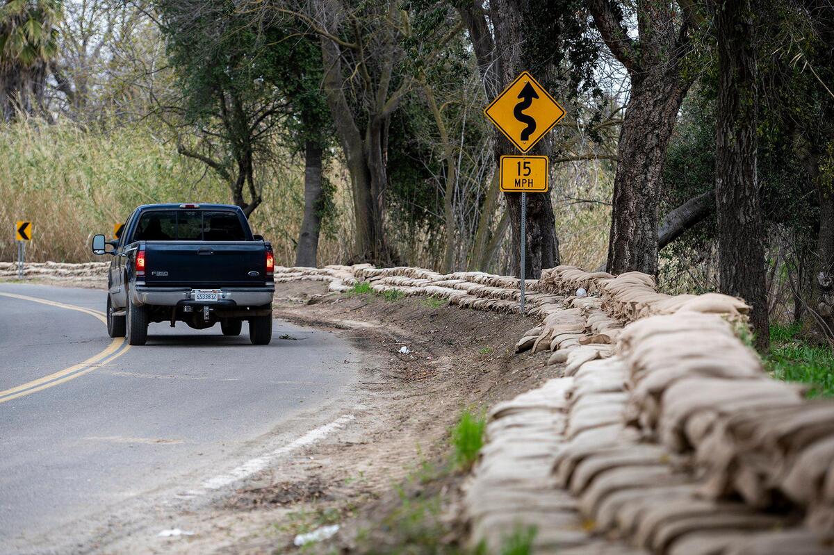 Sandbags line West North Bear Creek drive in Merced, Calif., on Thursday, March 9, 2023.