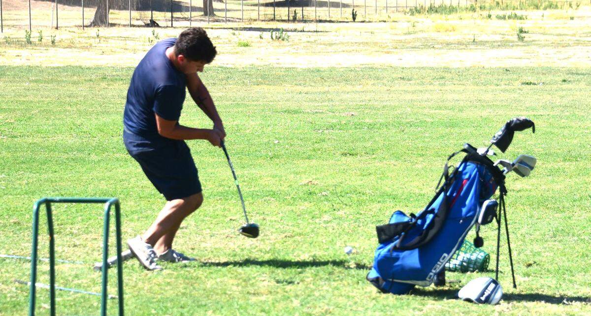 Justin Danel of Atwater practices in the driving range at Rancho Del Rey Golf Club in Atwater, Calif. on Tuesday, July 30, 2024.