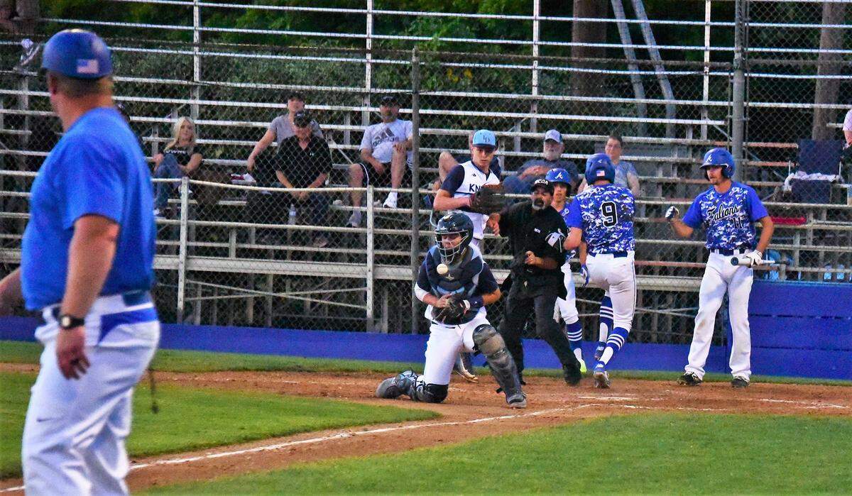 Atwater High junior Jacob Weiss beats the throw to the plate during the Falcons’ 12-6 win over Downey on Tuesday, April 23, 2019 at Memorial Ballpark in Atwater, Calif. 