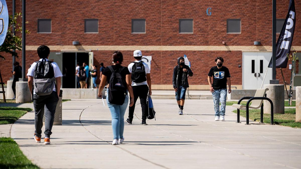 Students walk across campus during the first day of school at El Capitan High in Merced last August.