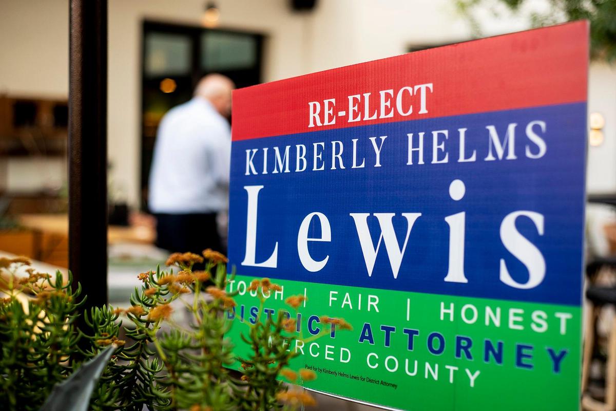 A campaign sign inside the courtyard of the El Capitan Hotel during a campaign party for Merced County District Attorney incumbent, Kimberly Helms Lewis in Merced, Calif., on Tuesday, June 7, 2022.