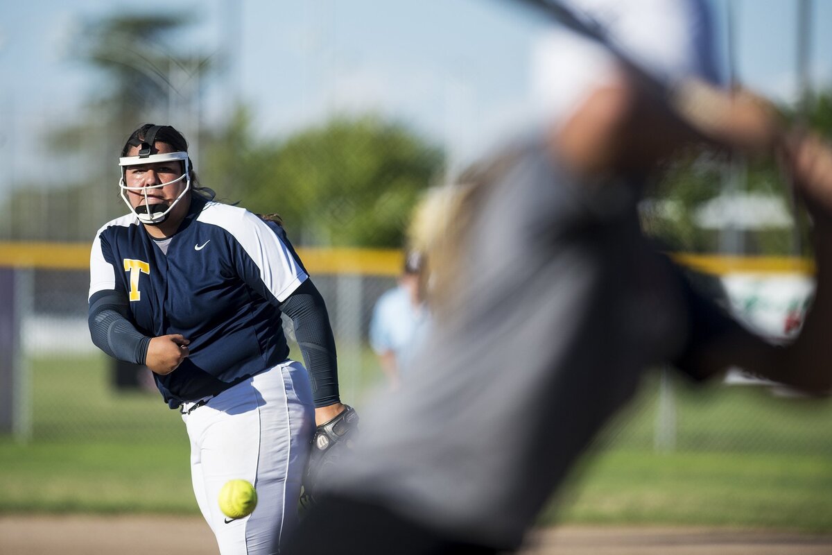 Turlock's Shelby Frutoz (27) delivers a pitch during the annual Paul Leonardo Memorial All-Star Game at Livingston High School in Livingston, Calif., on Tuesday, June 12, 2018.