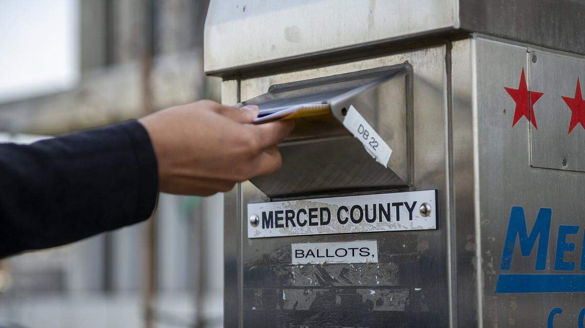 A ballot is placed in a Merced County ballot drop box outside the Merced County Administrative Building in Merced, Calif., on Tuesday, Nov. 5, 2024.