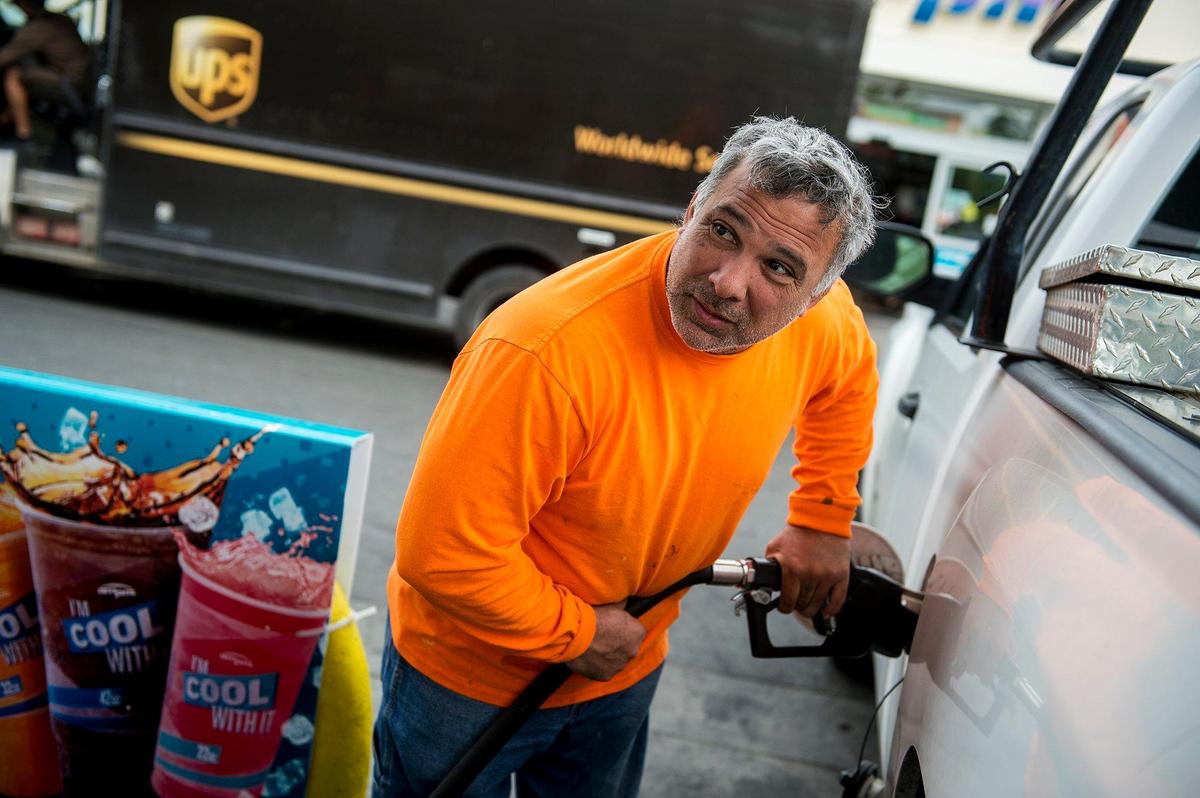 Merced resident Rey Correa, fills up hit truck’s gas tank at the Arco gas station near the intersection of G Street and East Olive Avenue in Merced, Calif., on Thursday, April, 11, 2019.
