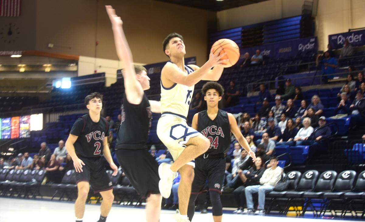 Stone Ridge Christian junior Kassius Salazar goes up for a layup against Valley Christian in the Sac-Joaquin Section Division VI championship game at UC Davis on Friday, Feb. 23, 2024. Salazar scored a game-high 31 points.