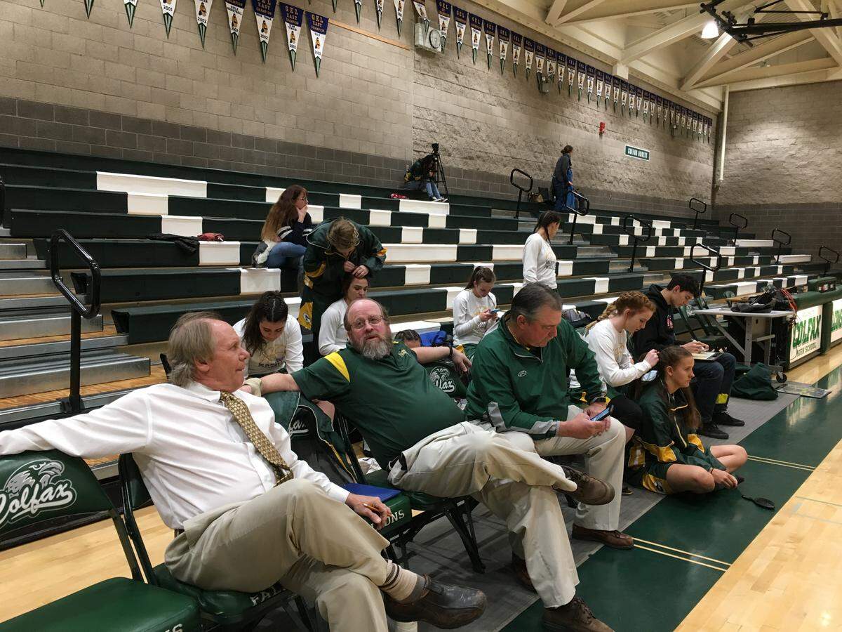 Mariposa High girls basketball coach Trace DeSandres (left) hangs out with his assistant coaches Tom Darcy (center) and Bruce Vegely (right) before a game in Colfax in 2018.