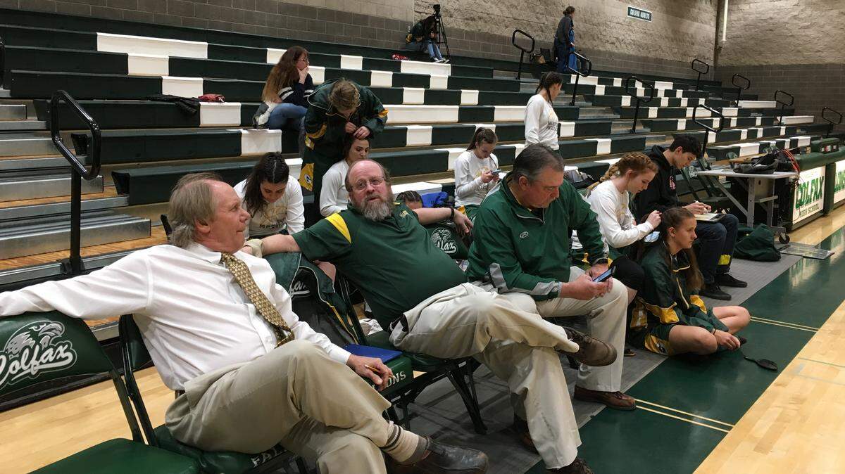 Mariposa High girls basketball coach Trace DeSandres (left) hangs out with his assistant coaches Tom Darcy (center) and Bruce Vegely (right) before a game in Colfax in 2018.