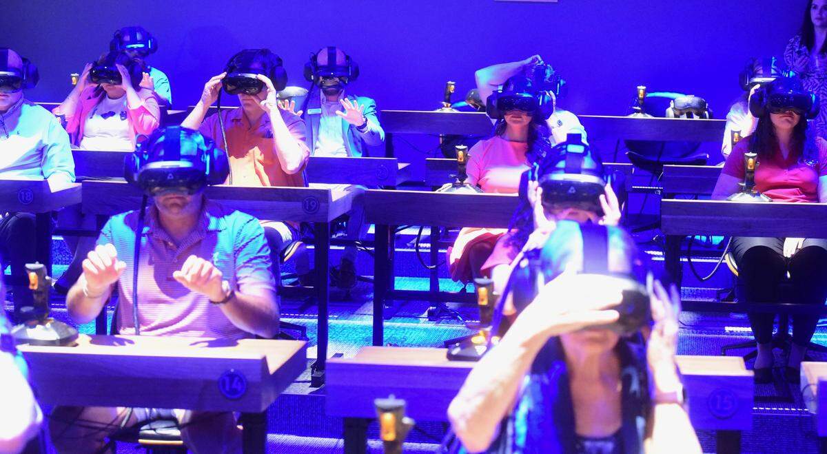 Community members go through a demonstration of new Dreamscape Learn Lab at Merced College in Merced, Calif. on Friday, Aug. 9, 2024.