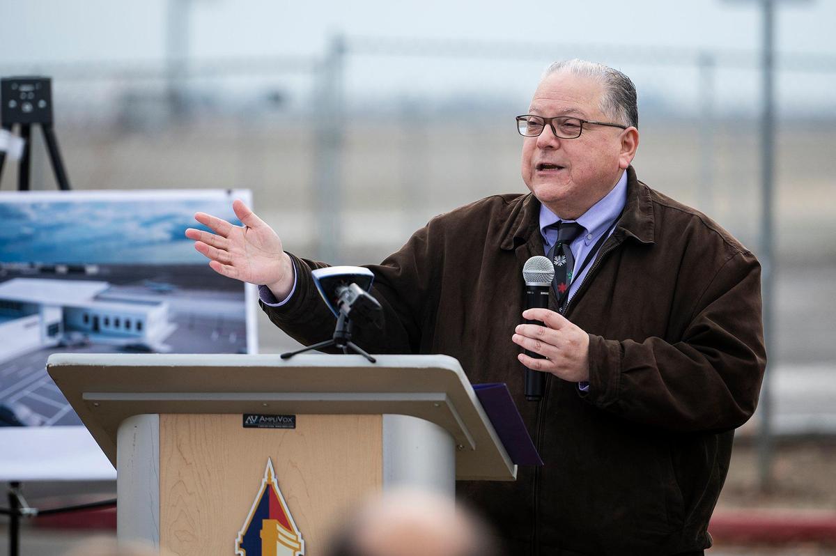 Merced Deputy City Manager Frank Quintero speaks during a groundbreaking ceremony for a $17 million dollar airport terminal replacement project at the Merced Yosemite Regional Airport in Merced, Calif., on Thursday, Dec. 21, 2023. The project will include updates to the existing 1940s-era terminal as well as the construction of a new energy-efficient and sustainable facility.