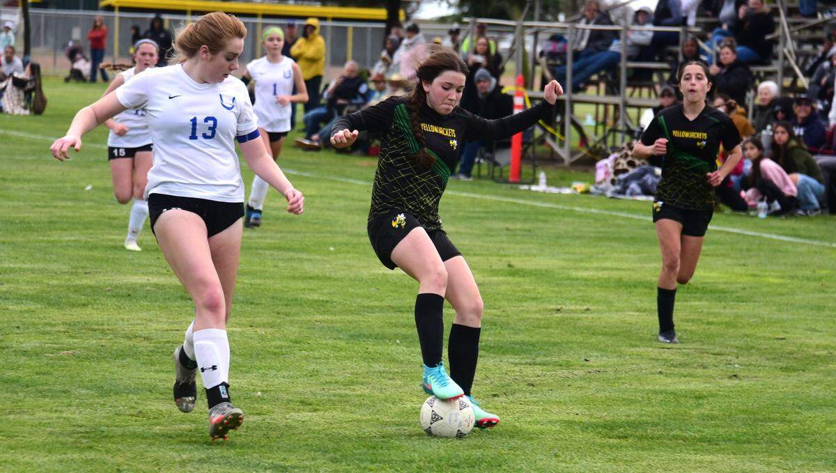 Hilmar High sophomore midfielder Brisa Gonzales (9) looks to make a move against a University Prep defender during the Northern California Regional Division V semifinal match on Thursday, Feb. 29, 2024 at Hilmar High School.