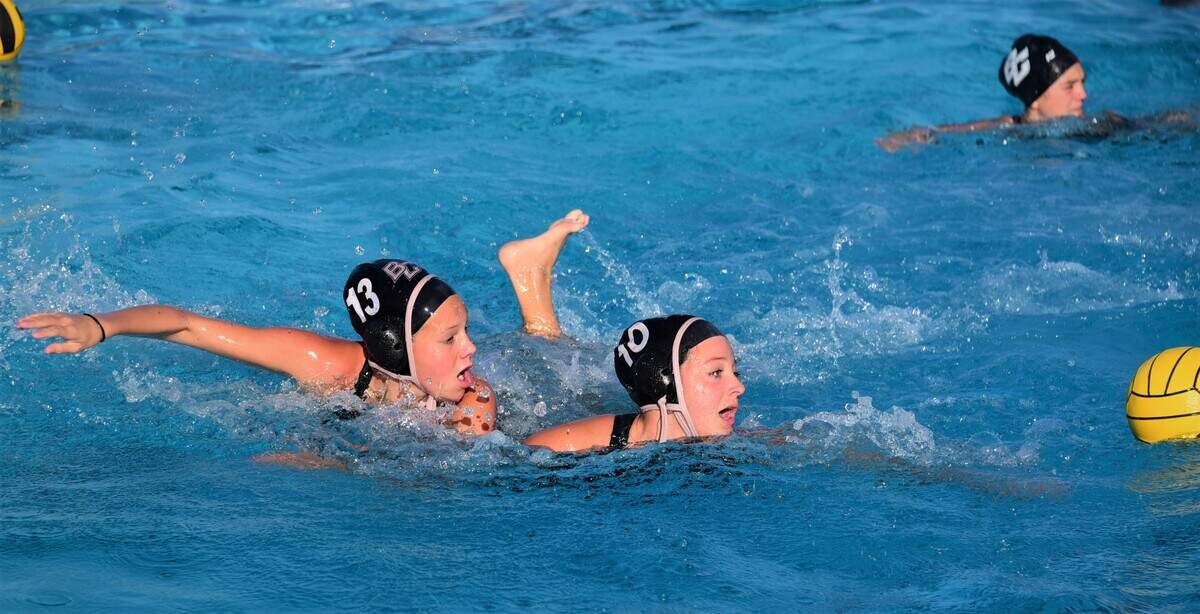 Buhach Colony senior Syndey Abril fights for control of the ball as sophomore sister Kyley Abril defends her during practice on Thursday, Oct. 28, 2021 at Buhach Colony High School.