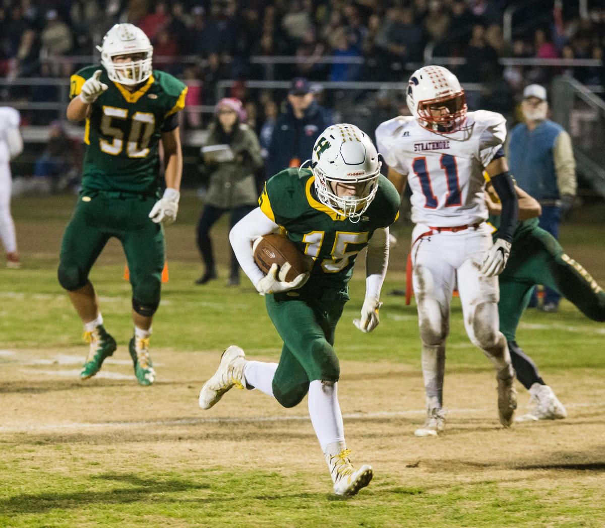 David Amaral, 15, of Hilmar High runs in a touchdown run against Strathmore High during the CIF State 6-AA High School Football State Championships at Hilmar High Saturday Dec. 15, 2018.