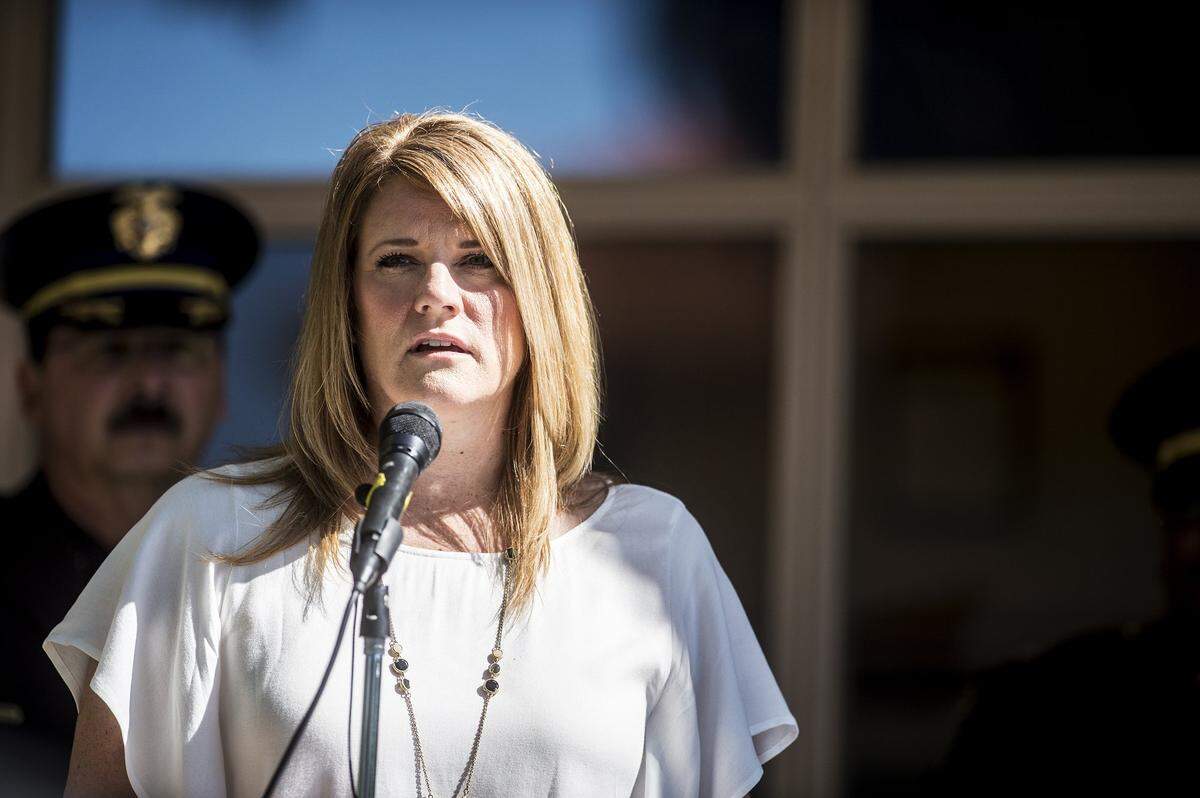 Michelle Gray speaks about her late husband Stephan Gray, during a memorial for the fallen Merced Police officer, at the Merced Police Department, Wednesday, April 15, 2015. Gray, 34, was shot and killed in the line of duty April 15, 2004, chasing a gang member. 