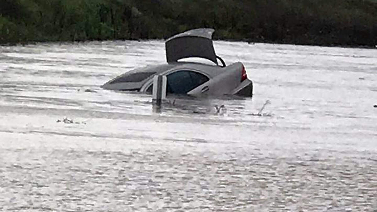 A car was submerged on Highway 59 between Oakdale Road and Nevada Street after trying to drive through deep water on Thursday, March 22, 2018, according to California Highway Patrol. That section of the highway has been closed.n
