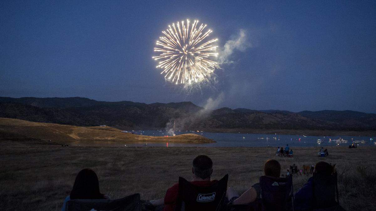 Fireworks explode during Lights on the Lake Fireworks at Lake McClure in Snelling, Calif., Saturday, July 2, 2016. 